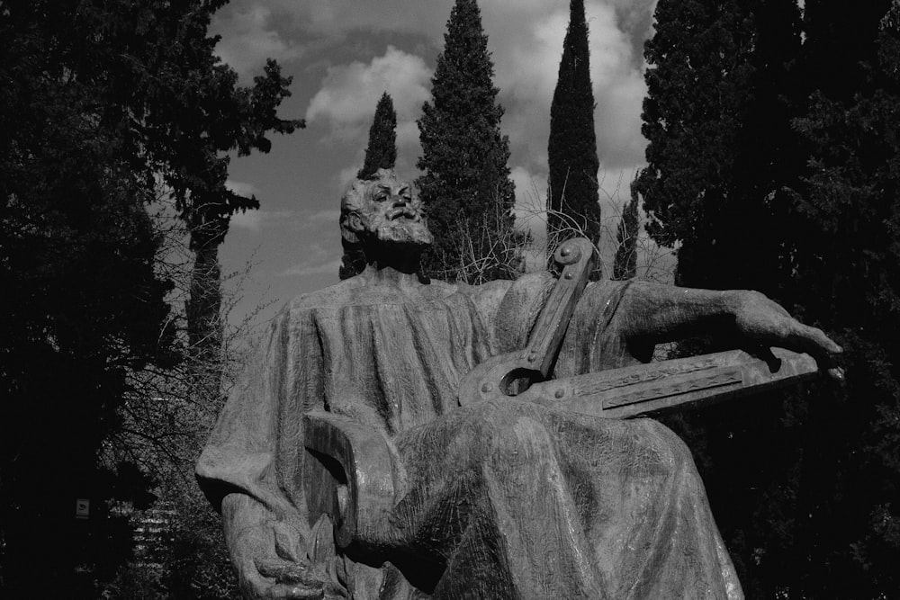 a black and white photo of a statue