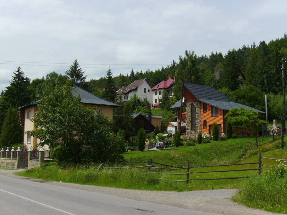 a row of houses sitting on the side of a road