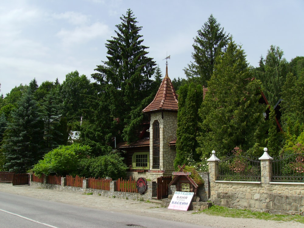 a small church with a sign in front of it
