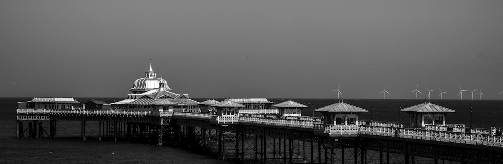 a black and white photo of a pier