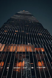 a very tall building lit up at night