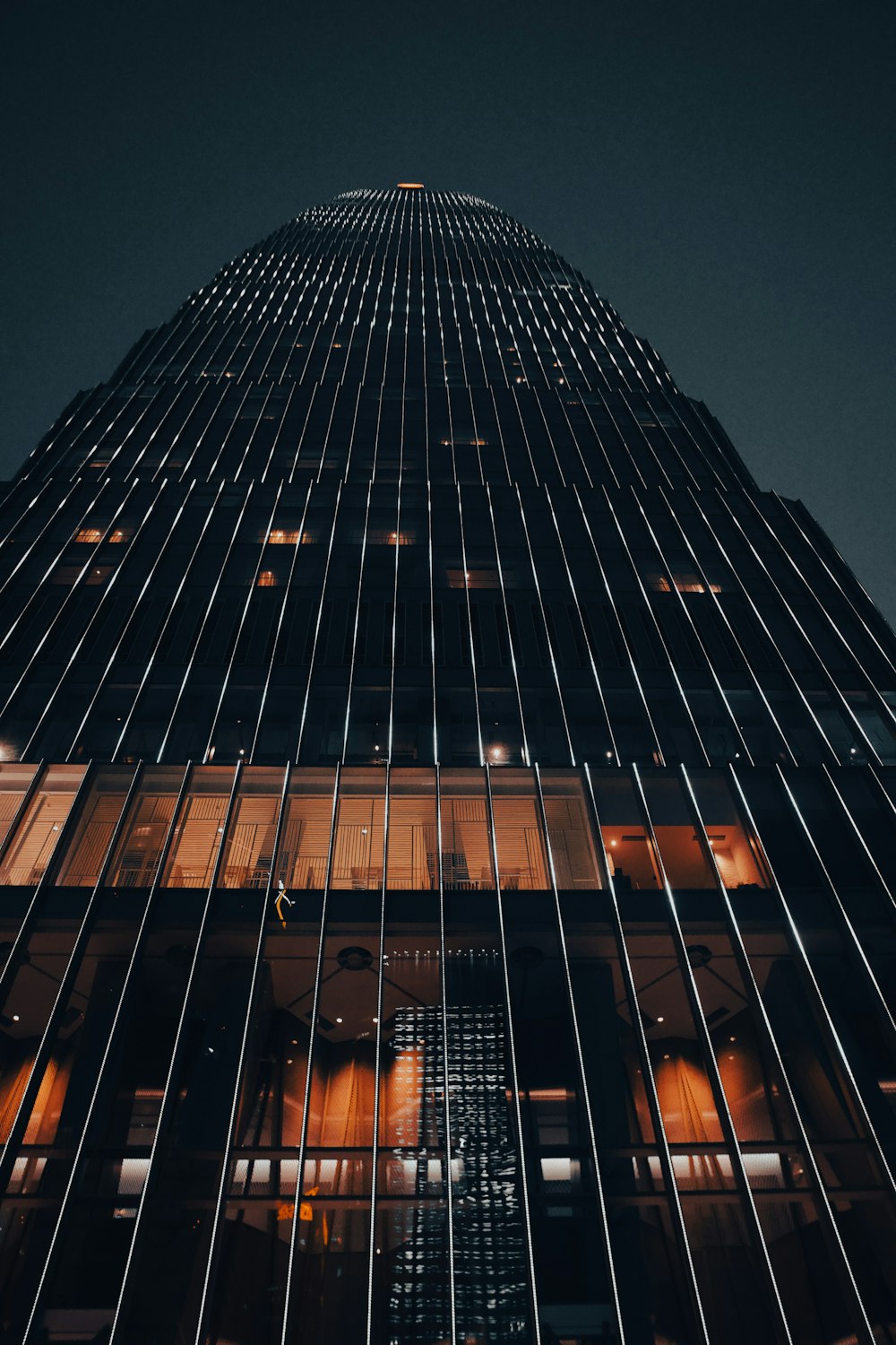 a very tall building lit up at night