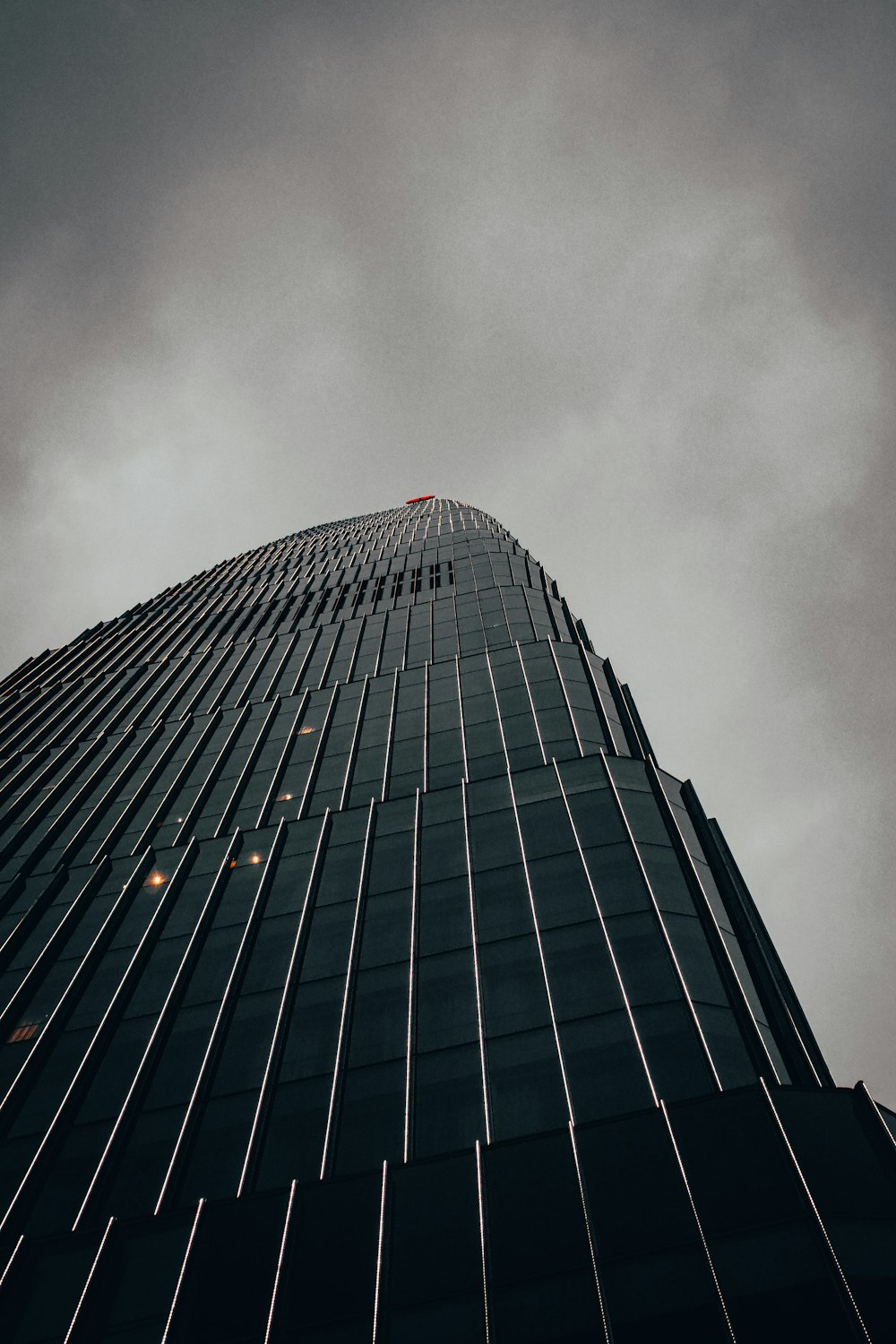 a very tall building with a sky in the background