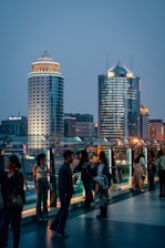 a group of people standing on top of a bridge