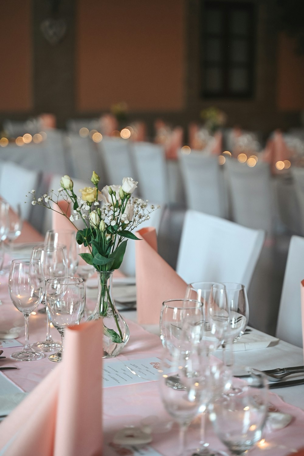 a table with a vase of flowers on top of it