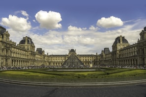 a large building with a pyramid in the middle of it