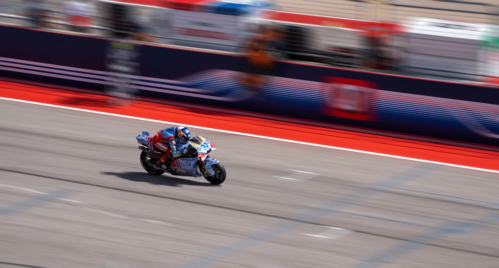 a person riding a motorcycle on a race track