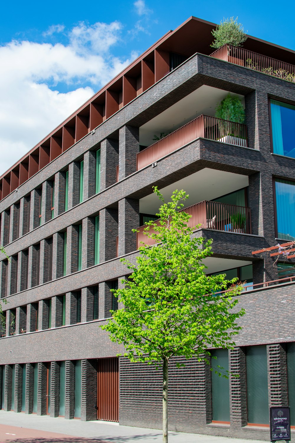 a building with a tree in front of it