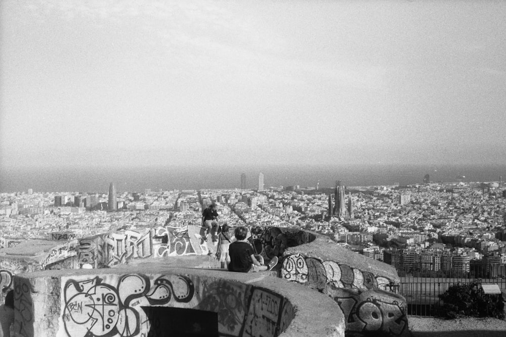 a black and white photo of a city with graffiti