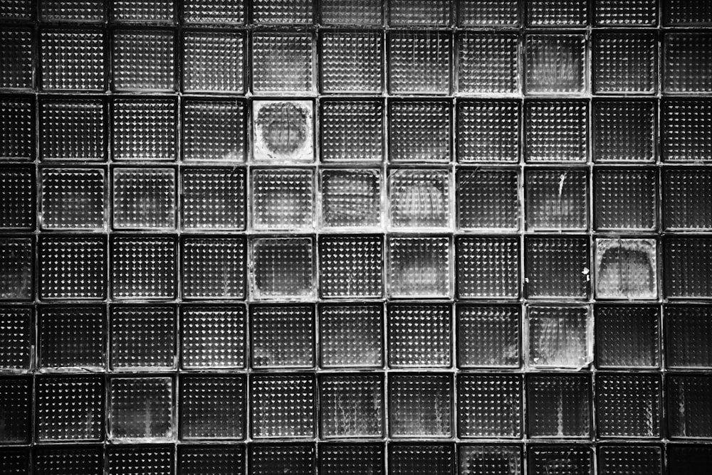 a black and white photo of a glass block wall