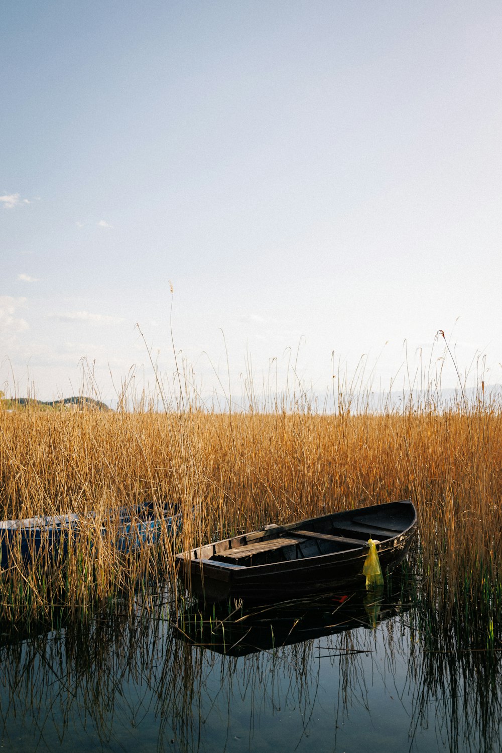 a small boat floating on top of a body of water