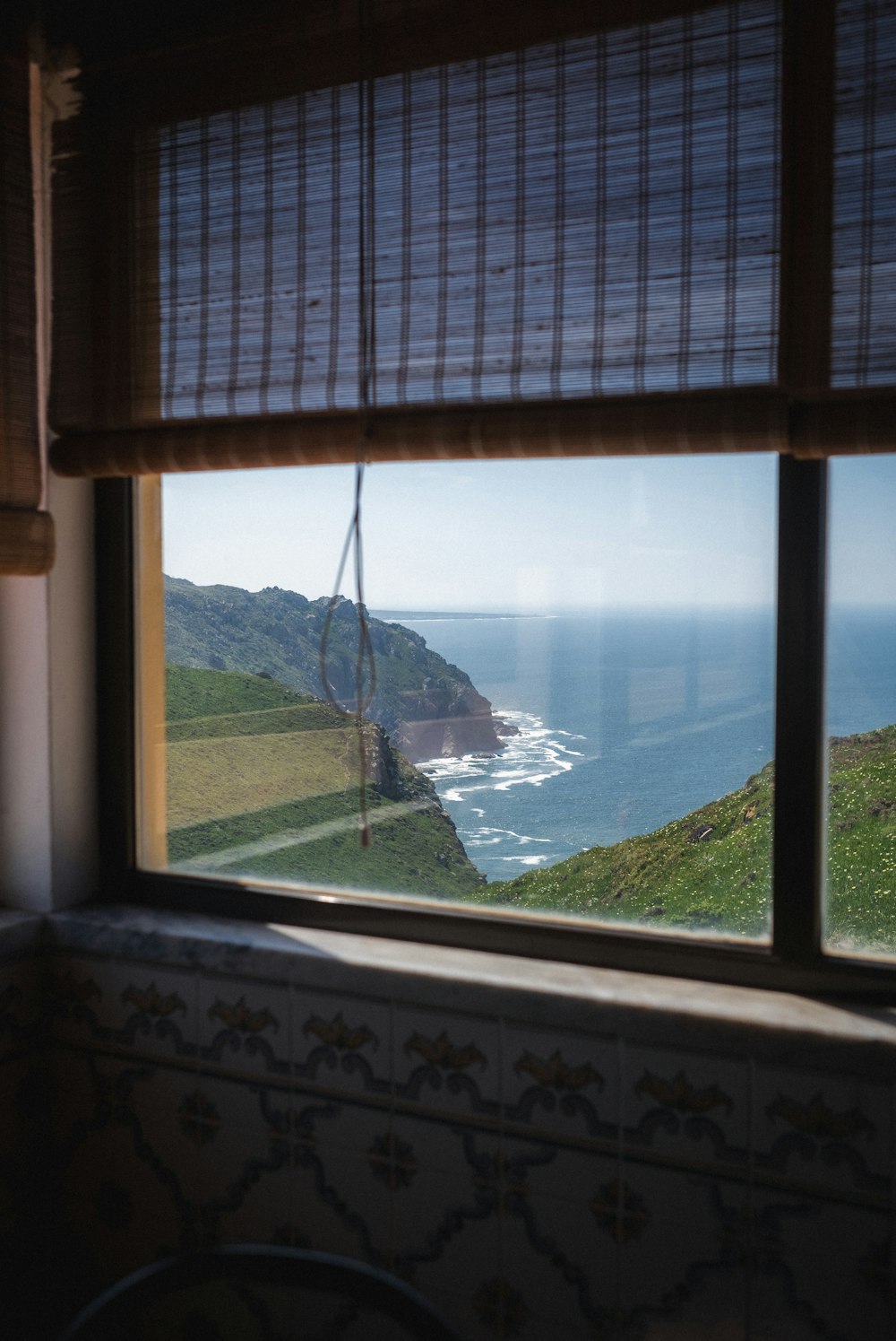 a window with a view of the ocean