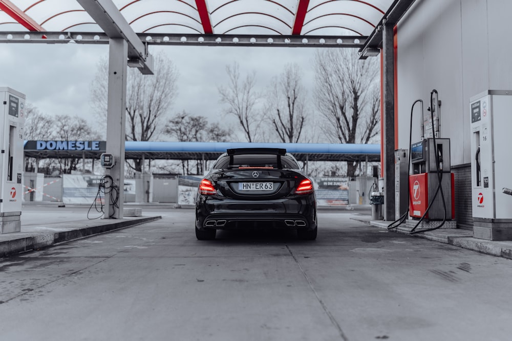 a car is parked at a gas station