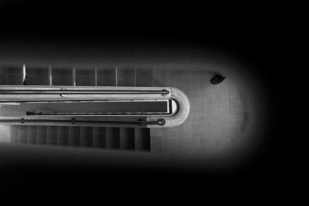 a black and white photo of a toilet in a bathroom