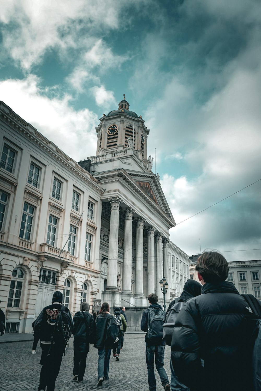 a group of people standing in front of a building