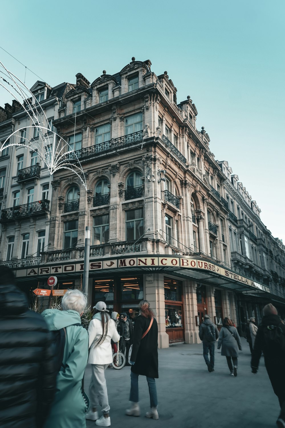 a group of people standing in front of a building