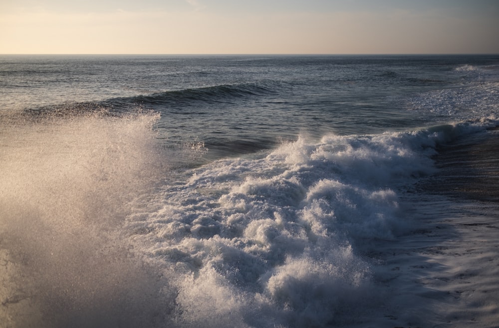 a person riding a surfboard on a wave in the ocean