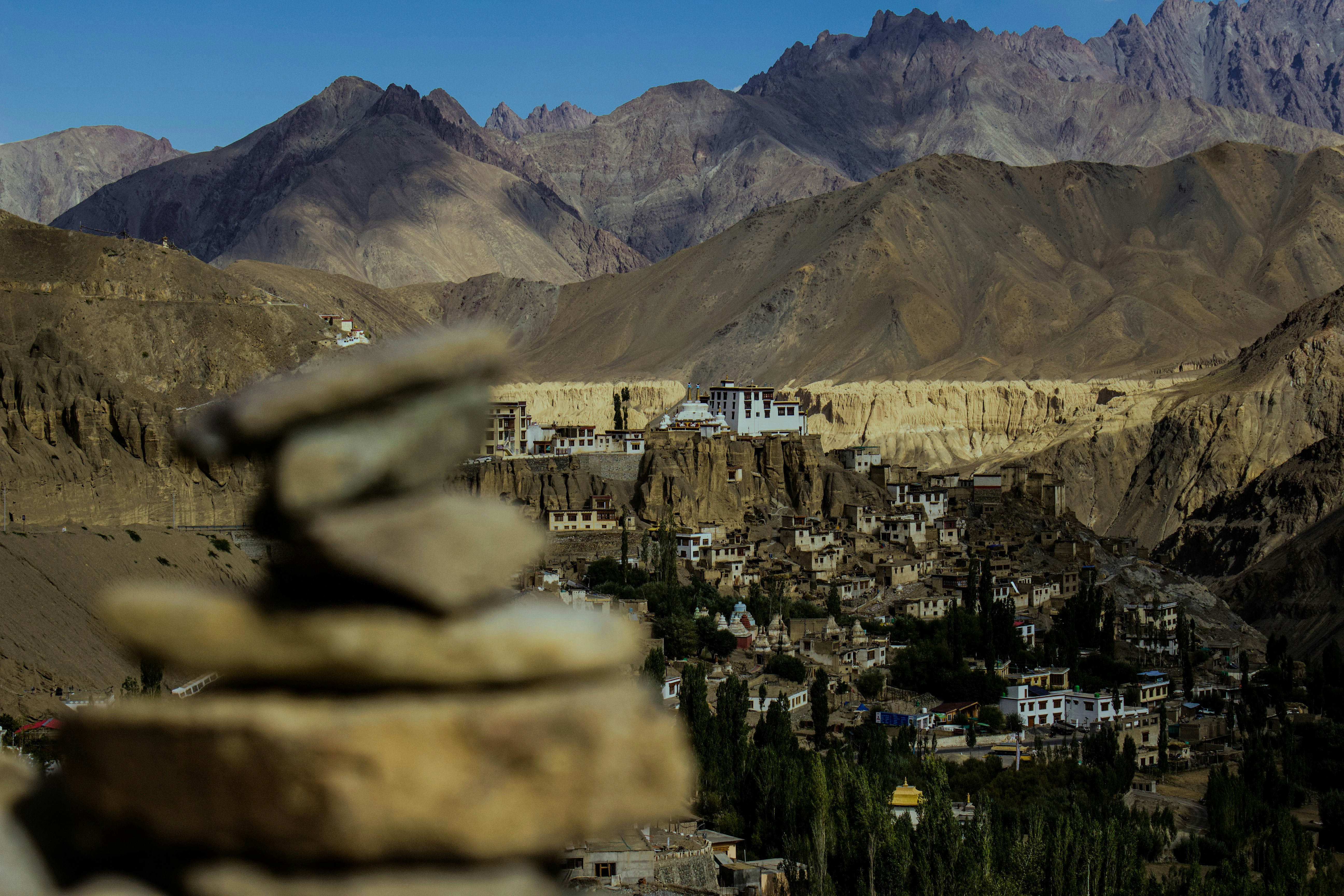a view of a village in the mountains