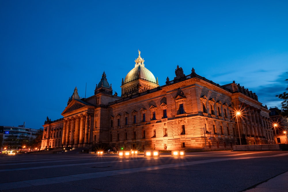 a large building with a dome lit up at night