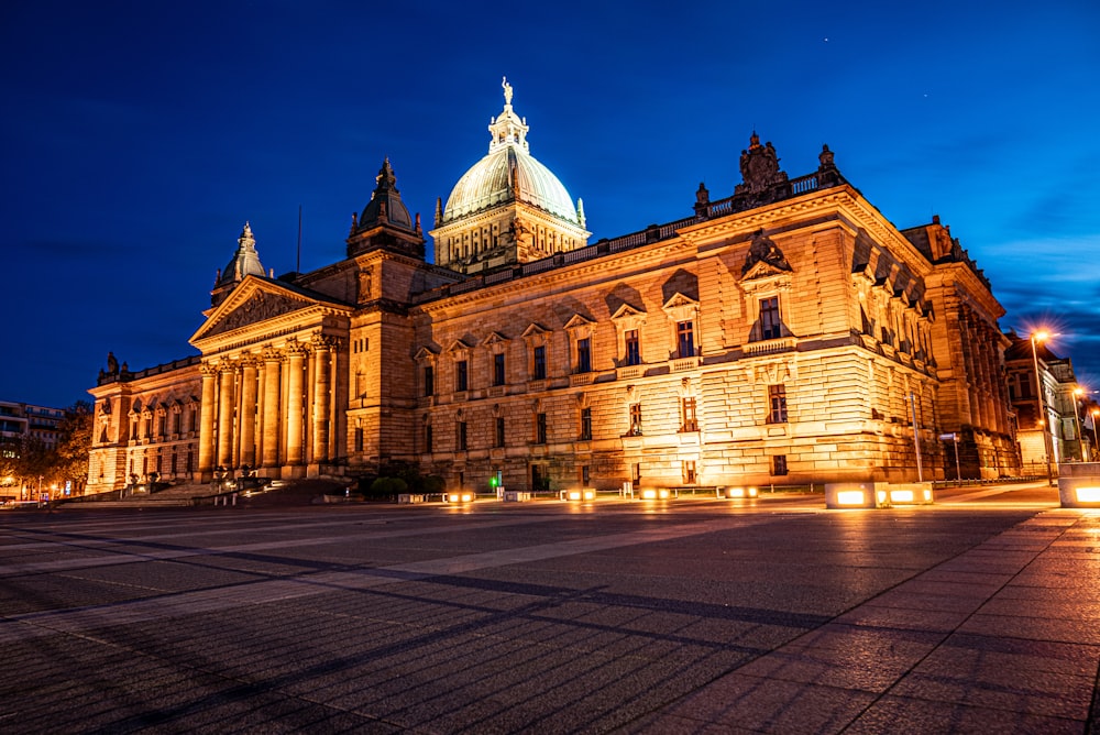 a large building with a clock tower at night