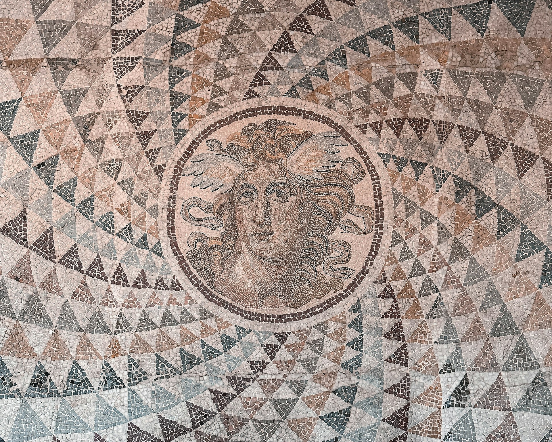 a close up of a mosaic on a wall