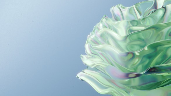 a close up of a green flower on a blue background