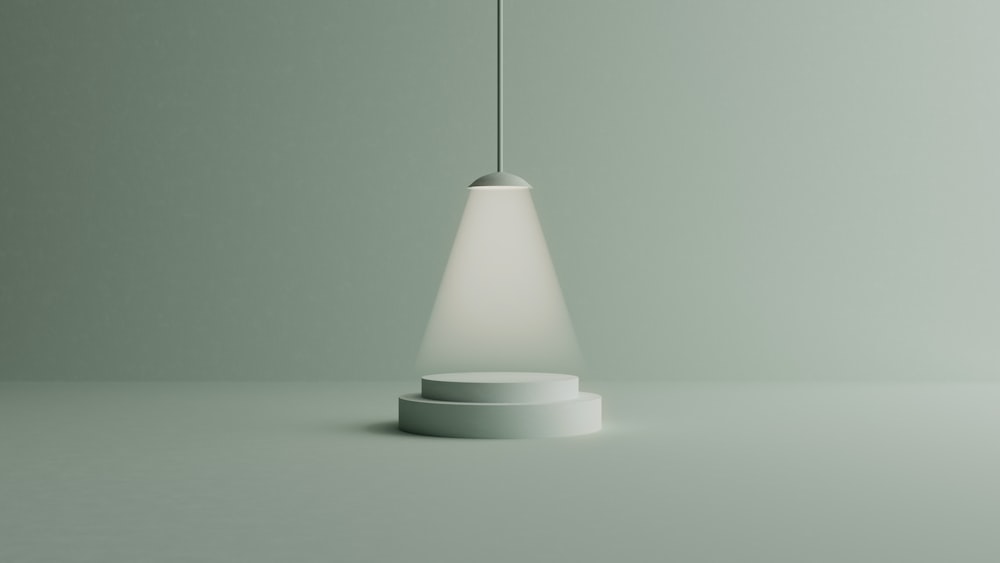 a white light hanging from a ceiling in a room