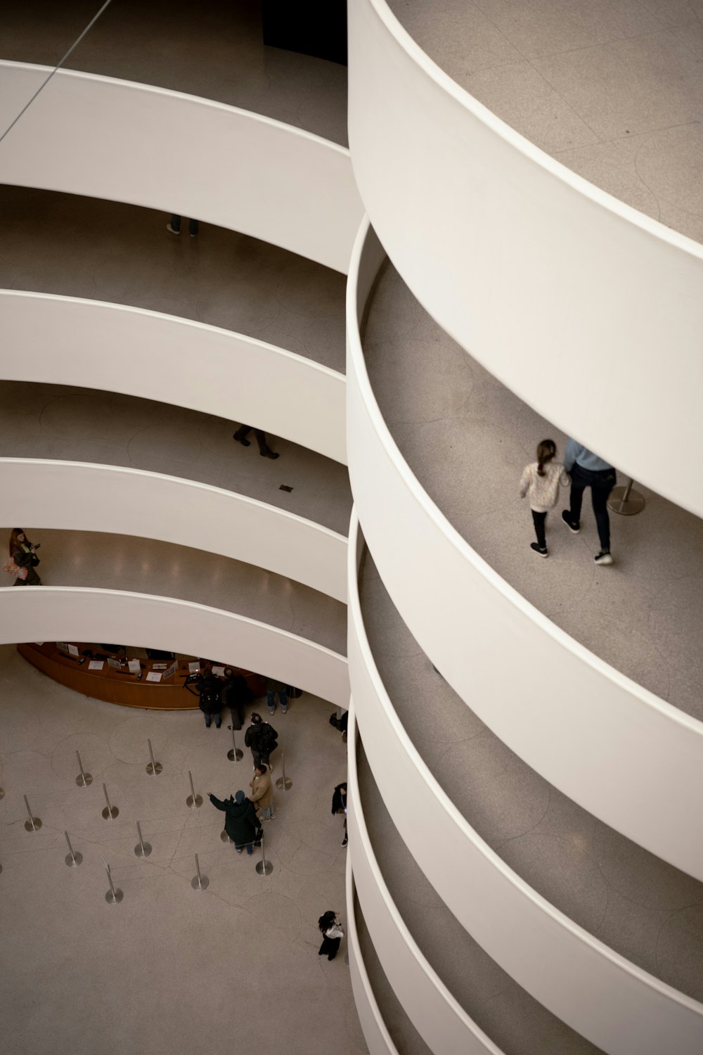 a group of people walking around a building