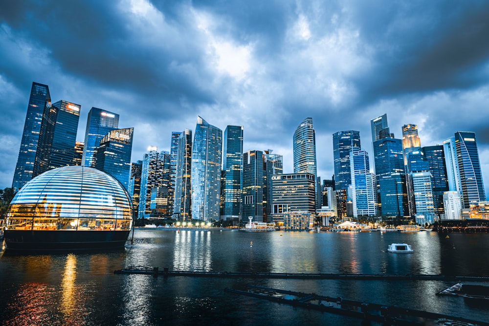 a large body of water with a city in the background