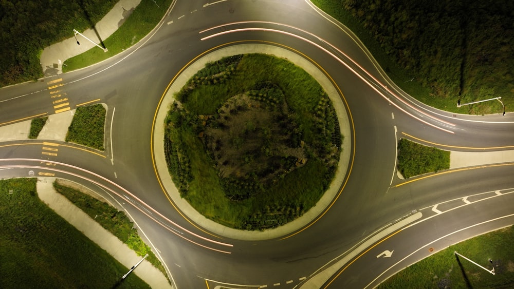 an aerial view of a road intersection at night