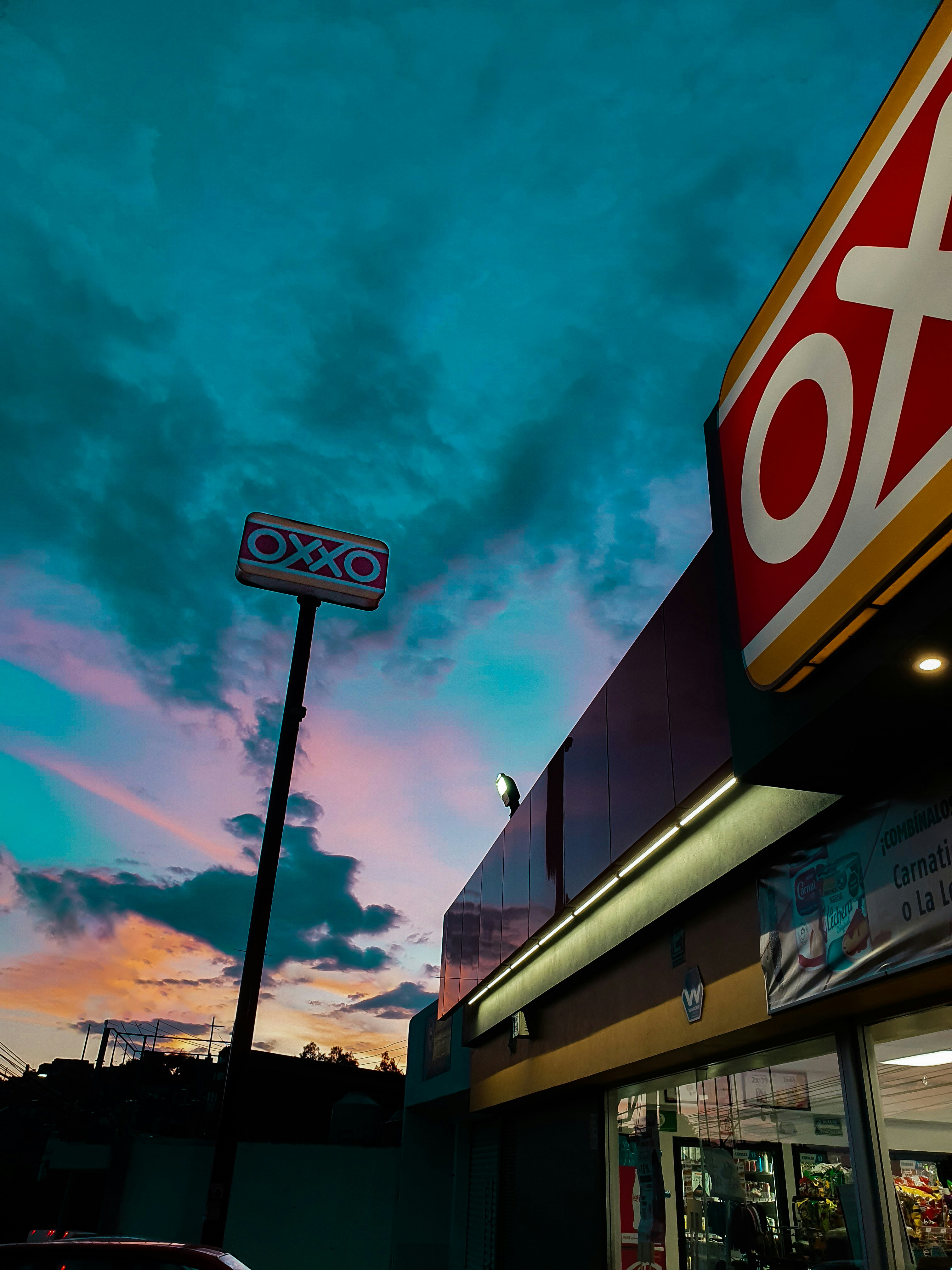 a store front with a sky in the background