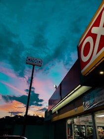 a store front with a sky in the background