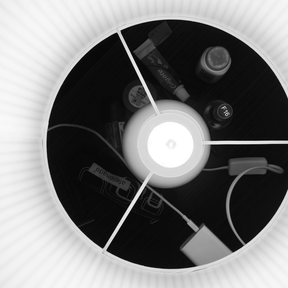 a black and white photo of a circular light fixture
