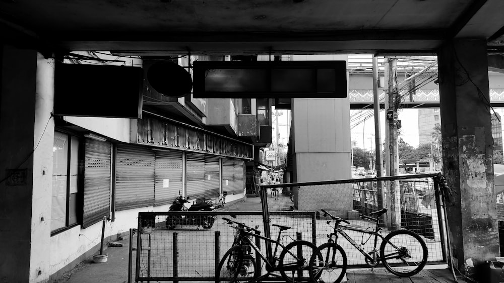 a black and white photo of a bike rack