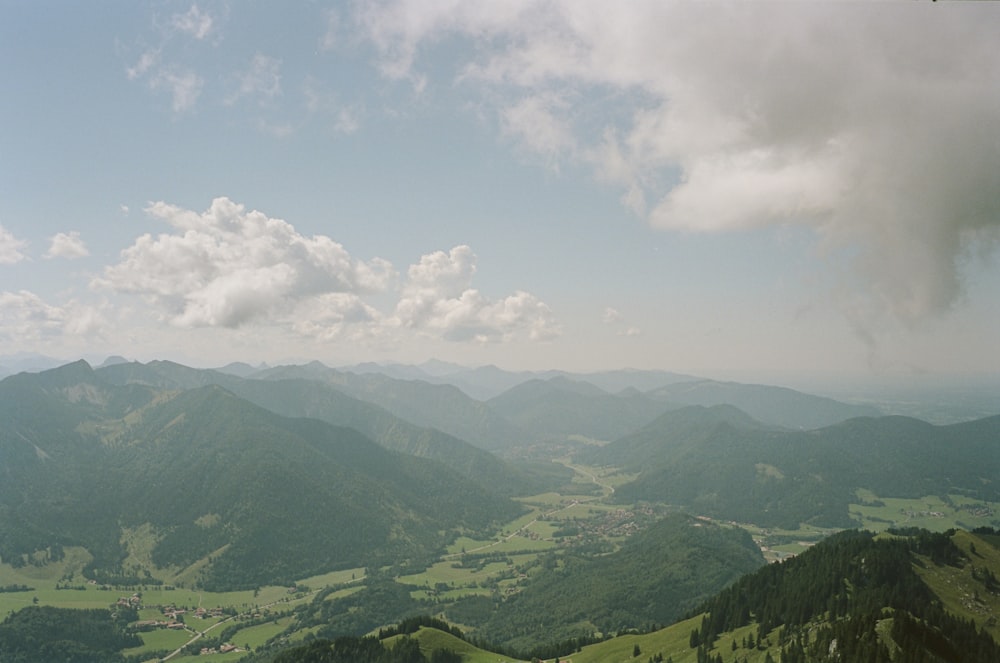 a view of a valley and mountains from a high point of view