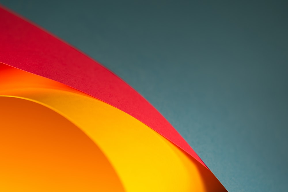 a close up of a red and yellow object