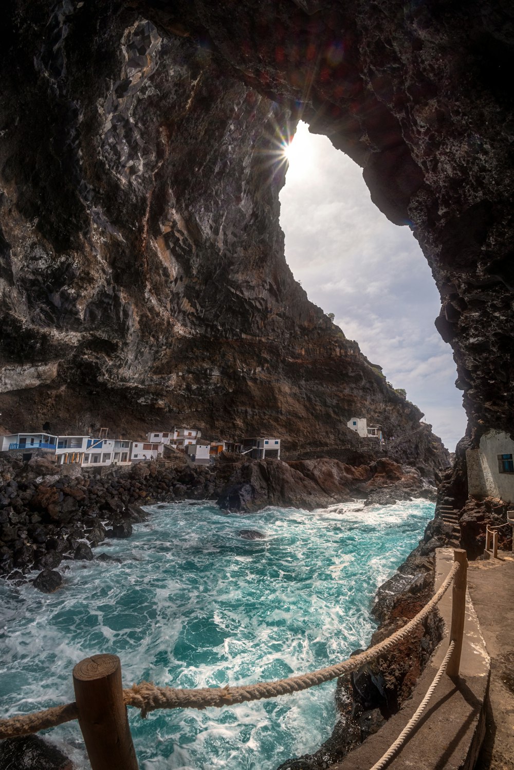 a view of the ocean from inside a cave