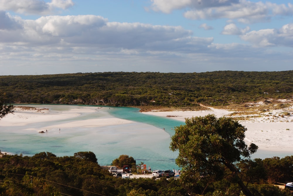 a view of a beach and a lagoon from a hill