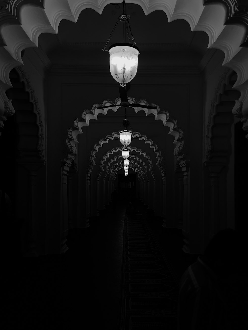 a black and white photo of a hallway