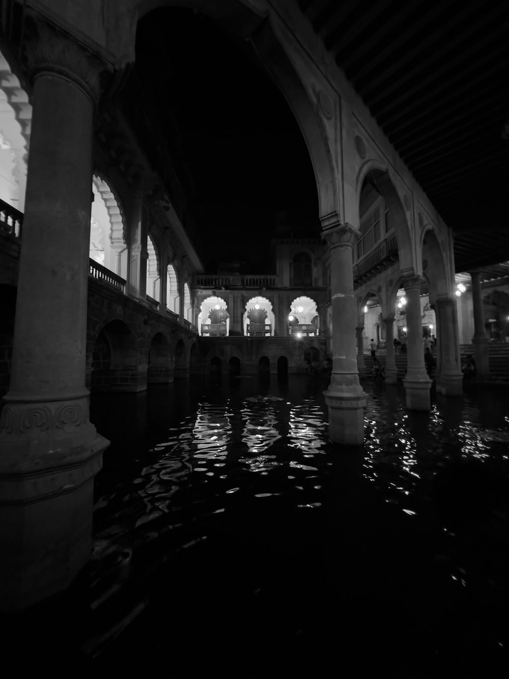 a black and white photo of a large building