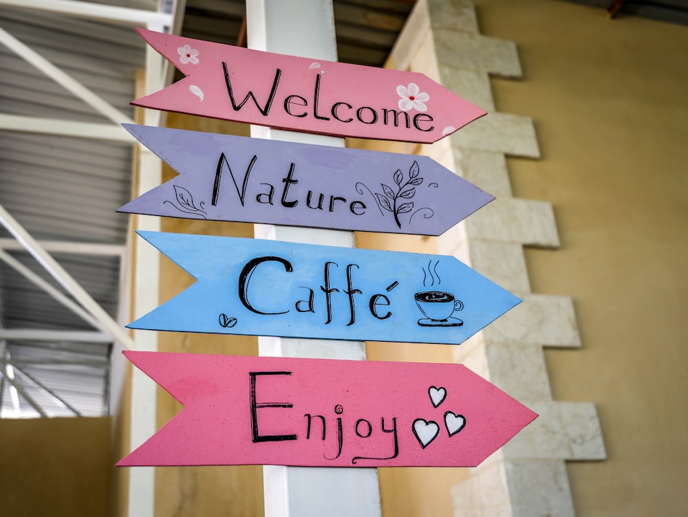 a sign that says welcome, nature, cafe, enjoy
