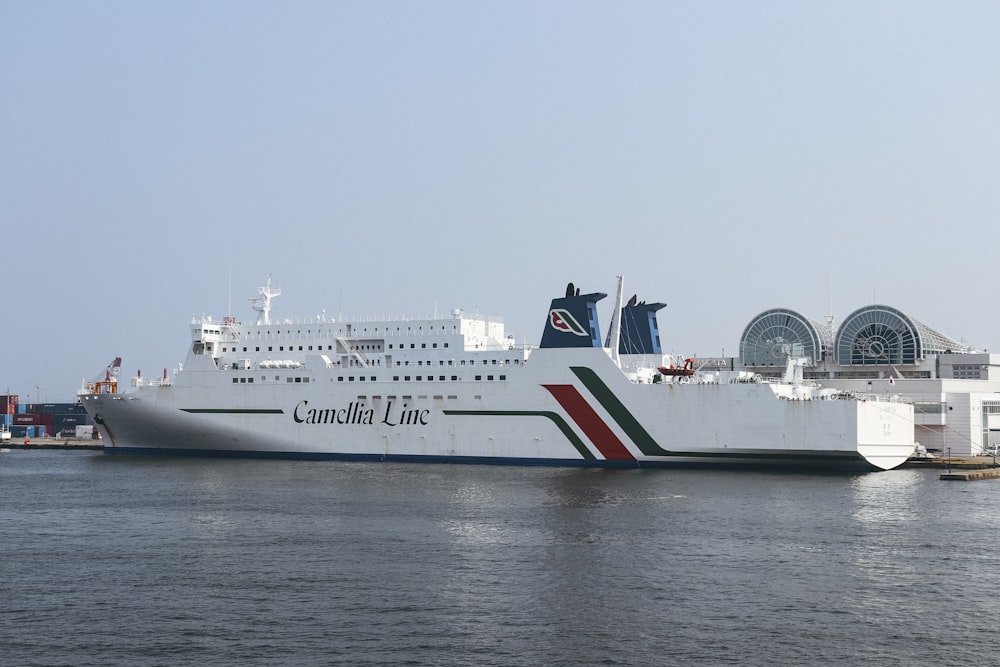 a large white boat floating on top of a body of water