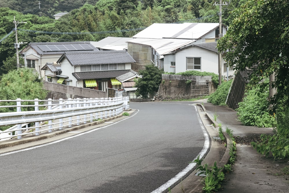 a street with houses and trees on both sides