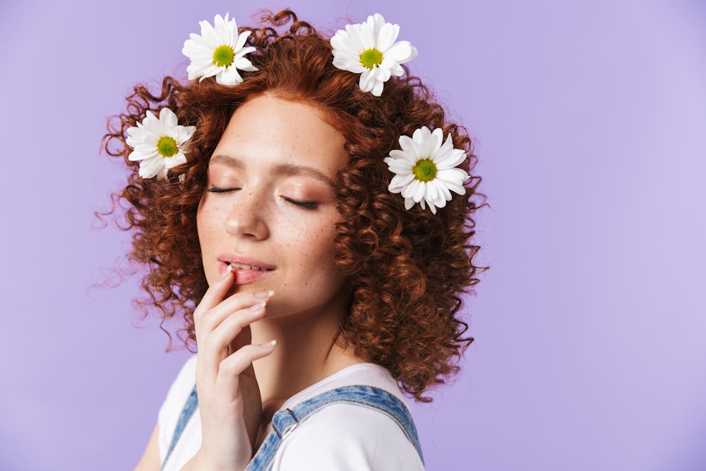 a woman with flowers in her hair