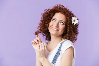 a woman with a flower in her hair