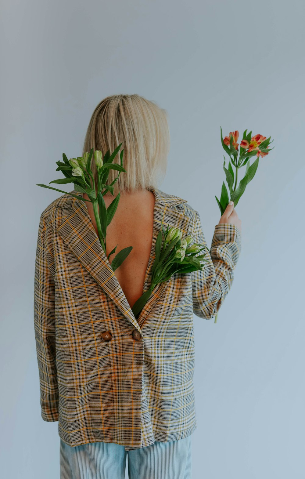 a woman holding flowers in her hands