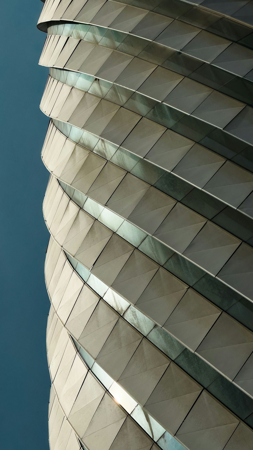 a tall building with many windows on top of it