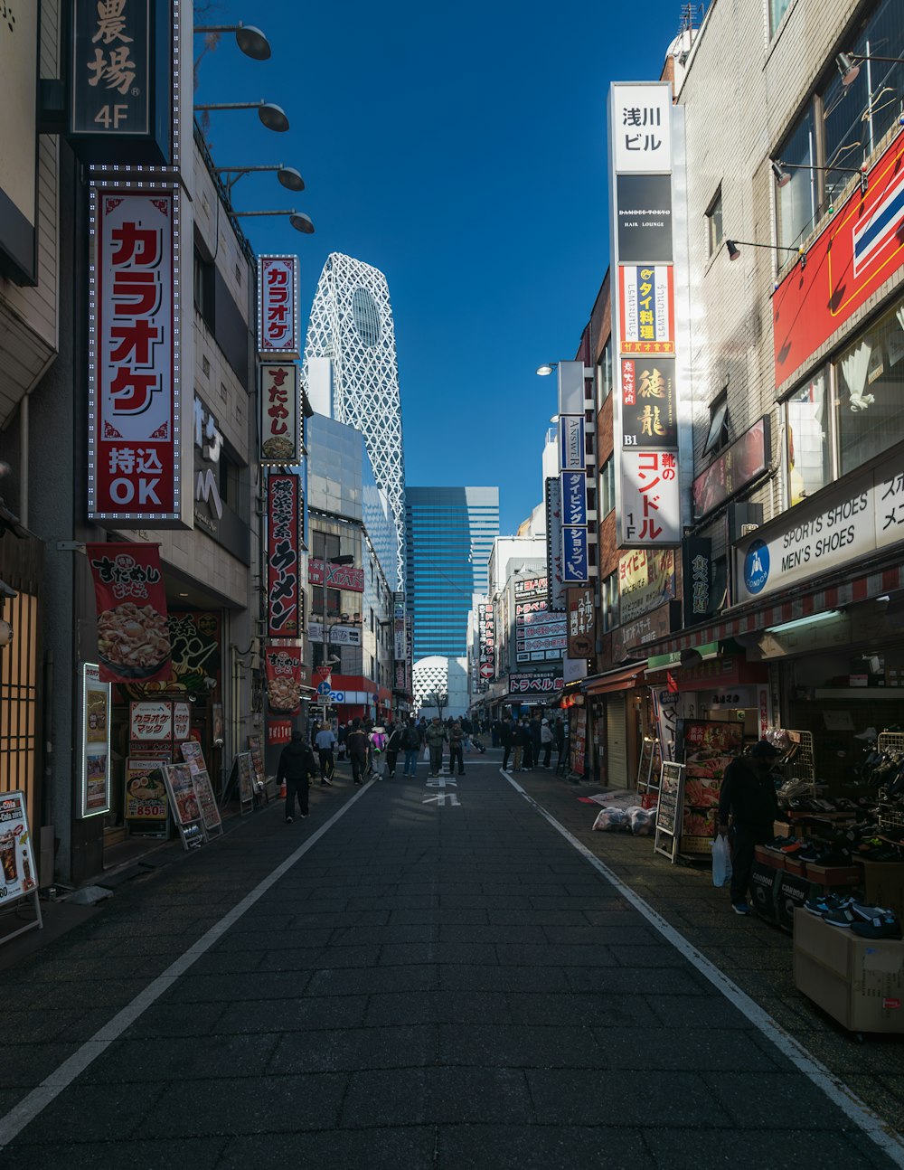 a city street lined with shops and people