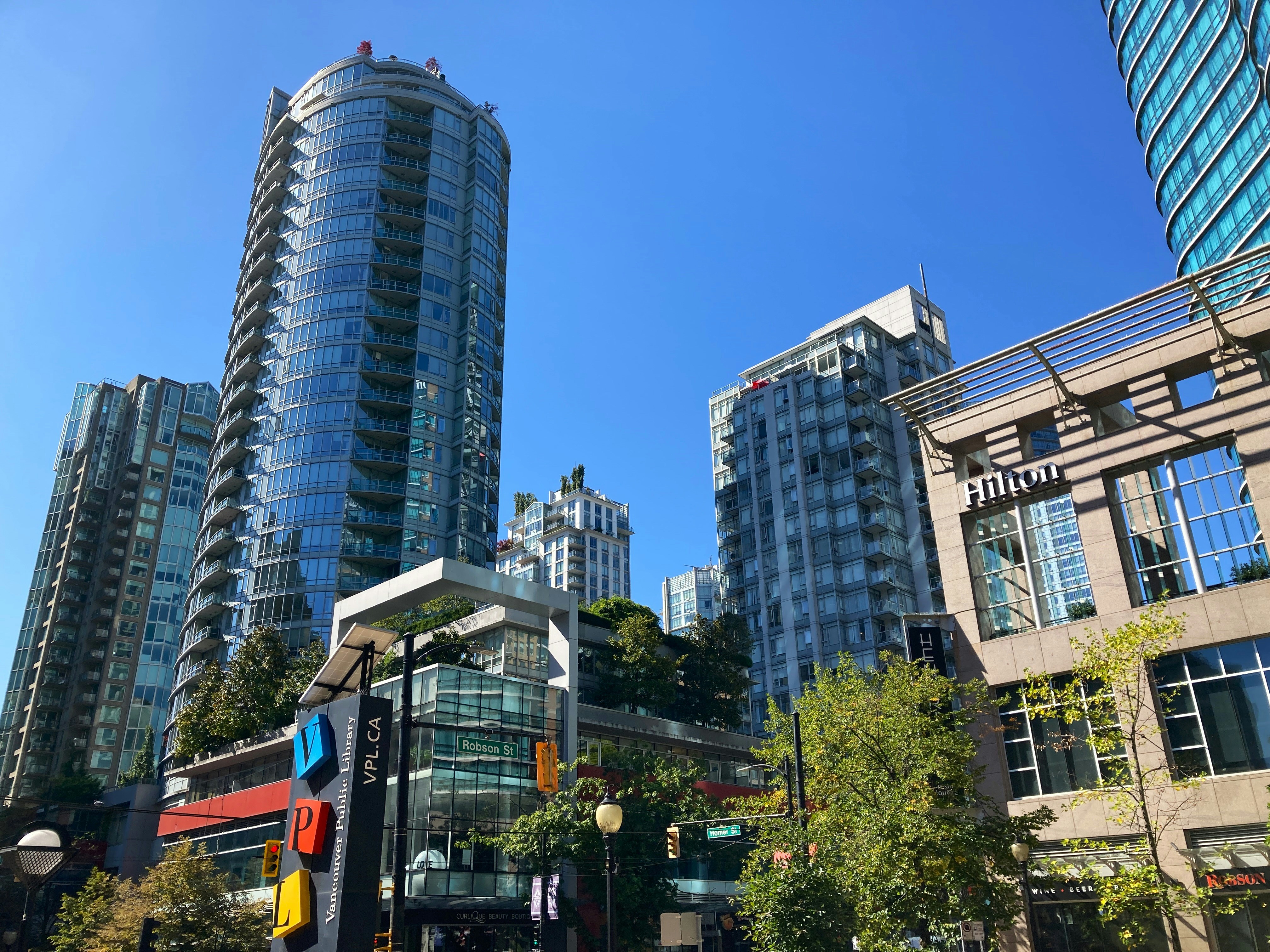 a group of tall buildings sitting next to each other, Downtown Vancouver, British Columbia, Canada