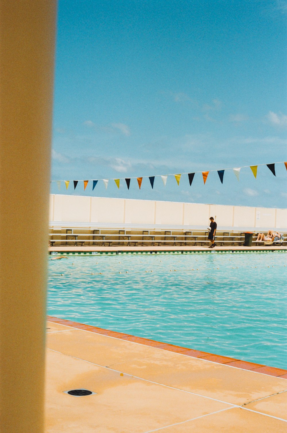 a man standing on the edge of a swimming pool